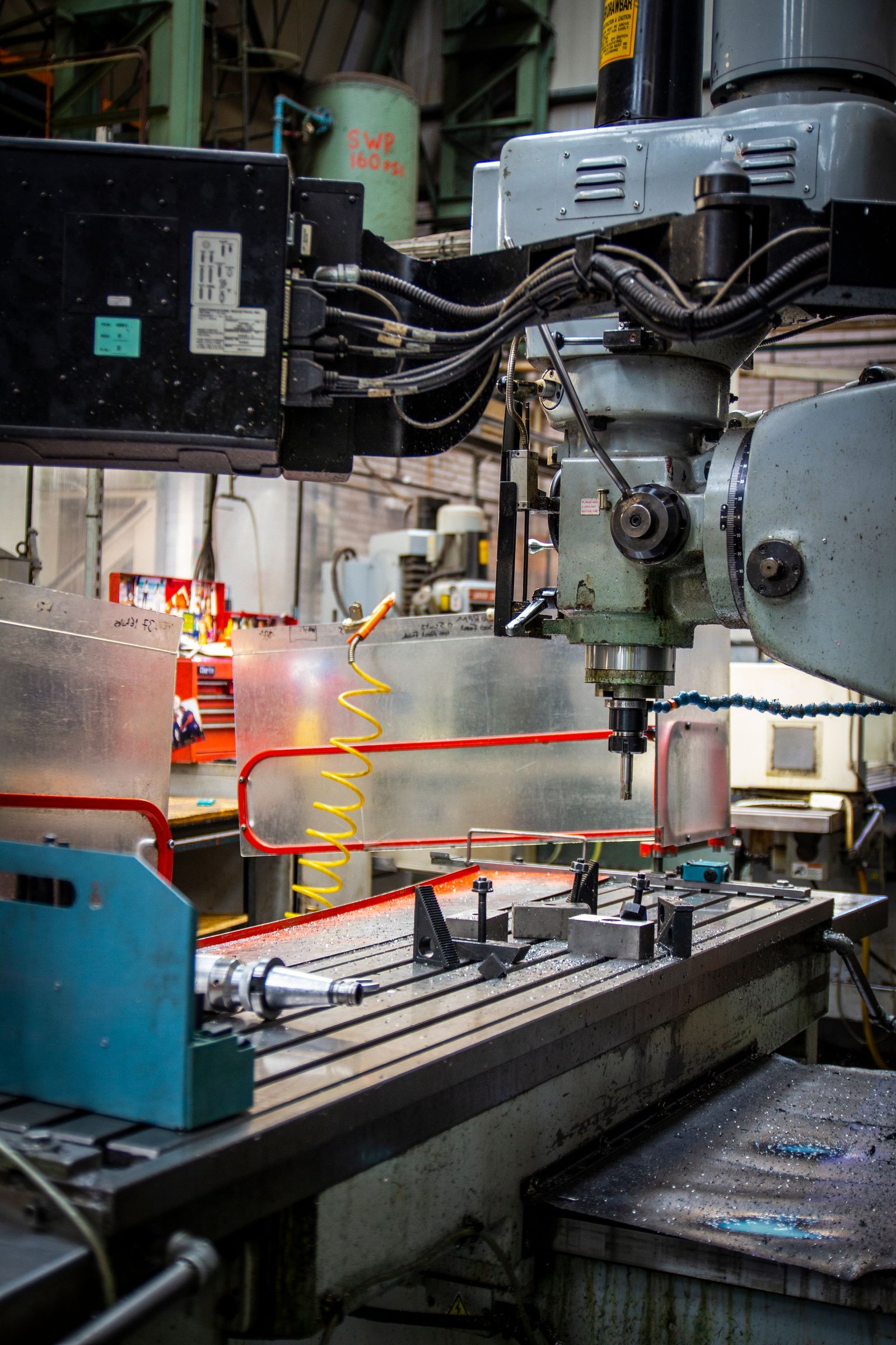 Industrial machining equipment in a busy machine shop (stock photo, illustrative)