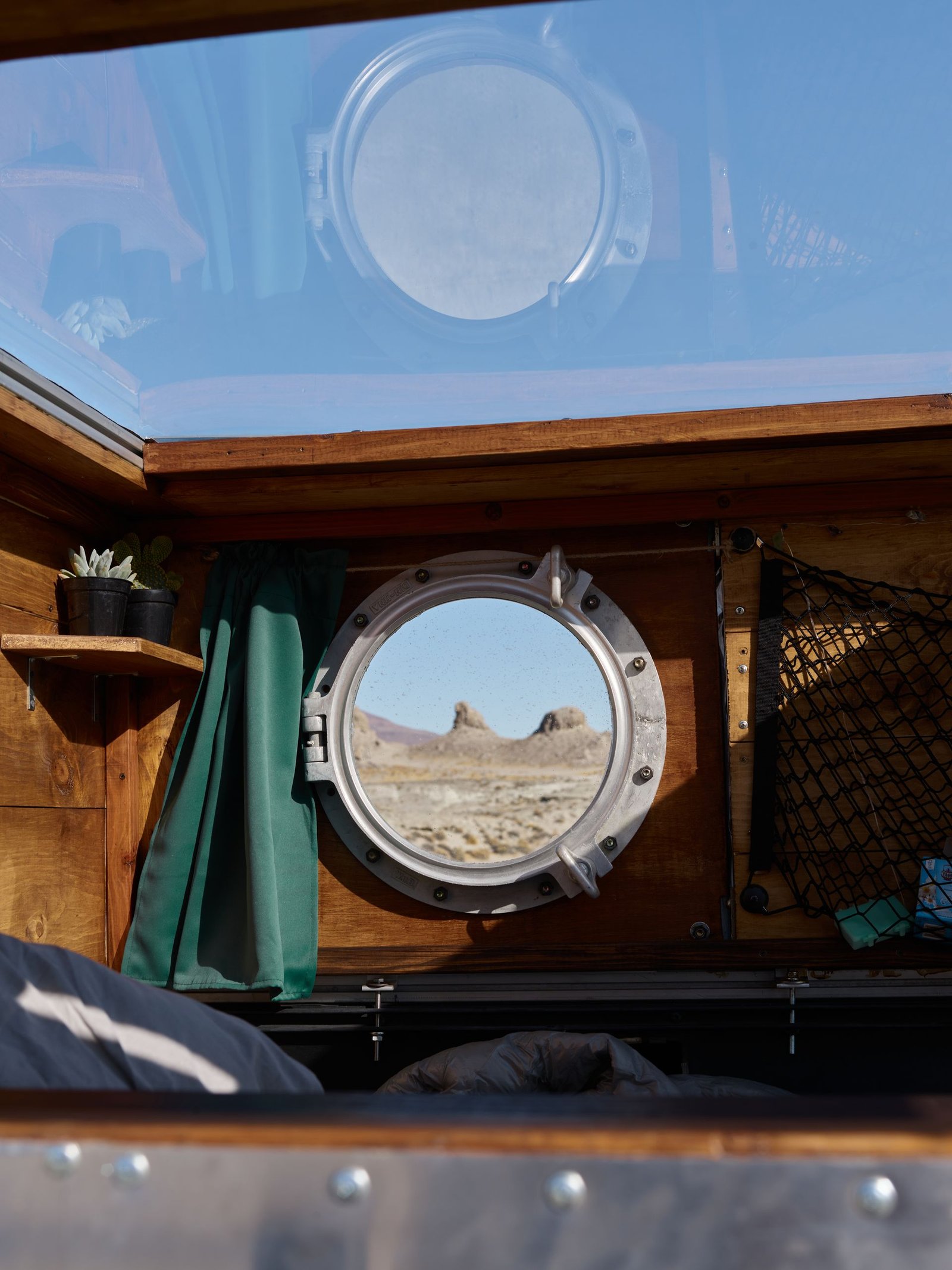 Interior of a camper van with a porthole window (stock photo, illustrative)